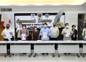 Department of Social Welfare and Development (DSWD) Secretary Rolando Joselito D. Bautista (middle), Philippine Association of Social Workers, Incorporated (PASWI) National President Raosauro Luntayao (2nd from right), and Association of Local Social Welfare and Development Officers of the Philippines, Incorporated (ALSWDOPI) National President Marybeth Ortiz (2nd from left) present the Memorandum of Understanding (MOU) sealing their partnership to ensure the development of the social work profession in the